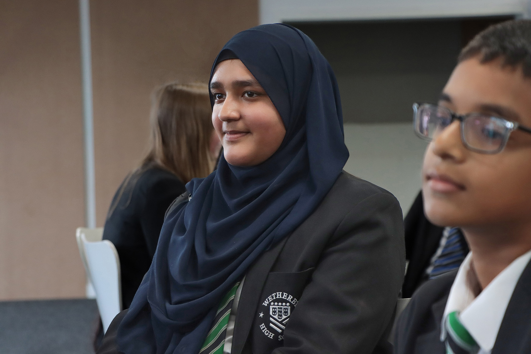 Girl smiling in a coaching circle